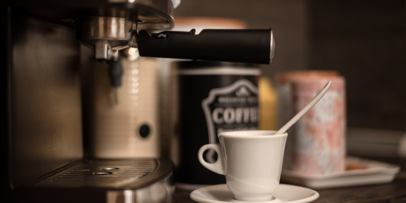 Make the Perfect Coffee Bar Coffee bar with an espresso machine and mug.
