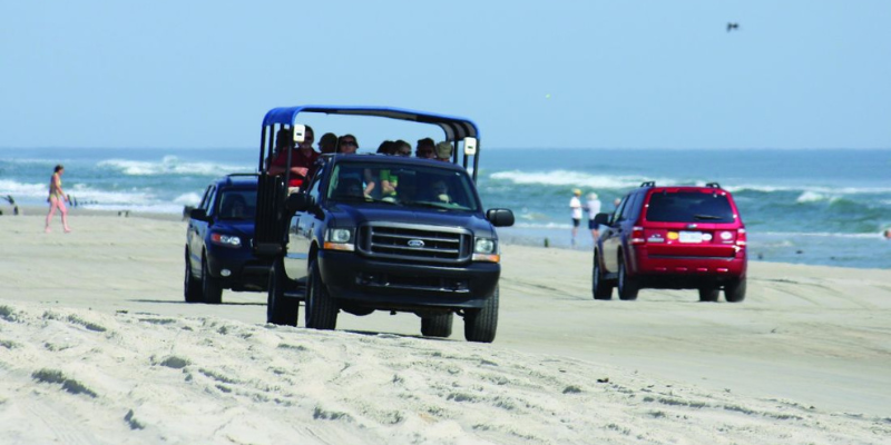 Bob's Wild Horse Tours Image of jeep on the sand.