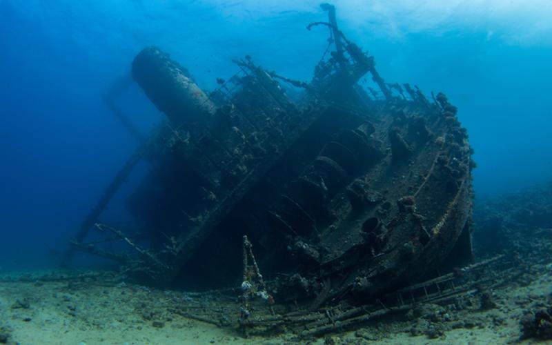 Old shipwreck covered in moss at the bottom of the graveyard of the Atlantic 
