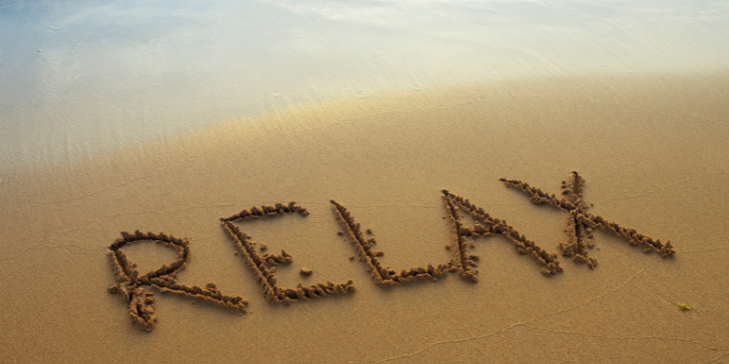 Relax The word "relax" written in the sand on beach.