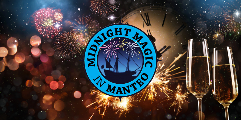 Midnight Magic in Manteo on New Years Eve Clock tower and fireworks in the background w/blue circle surrounding a ship in the center.