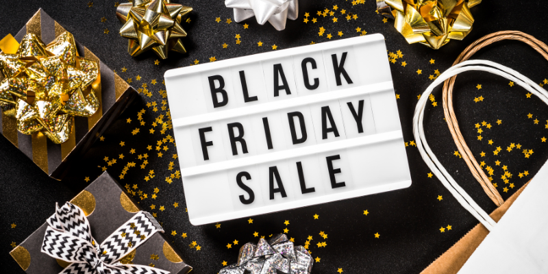 Black Friday Sale Black Friday Sale against black background with gold and silver presents.