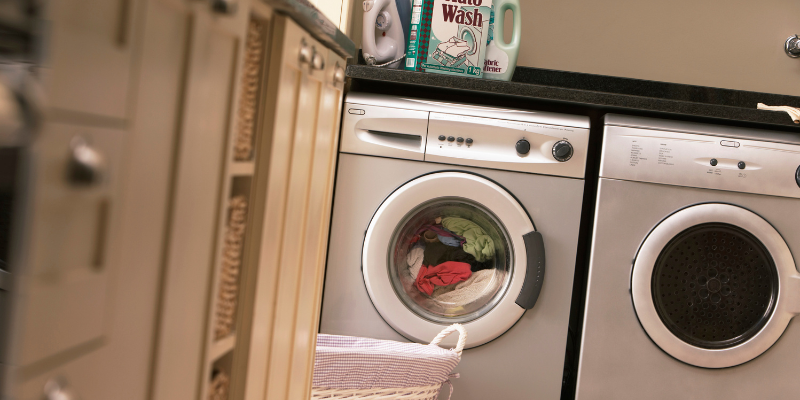 Sideways image of washing machine and dryer.