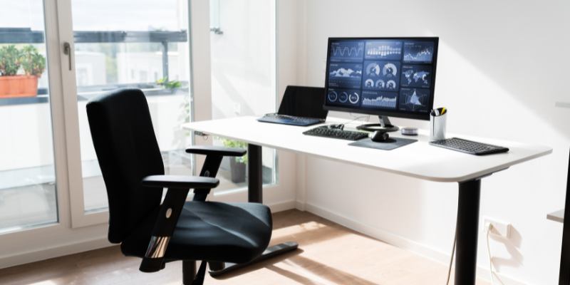 Choose Ergonomic Furniture Comfortable work chair with desk near balcony.