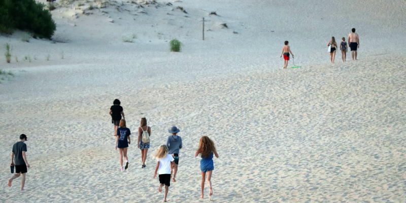 Aerial image of people running at Jockey's Ridge State Park.