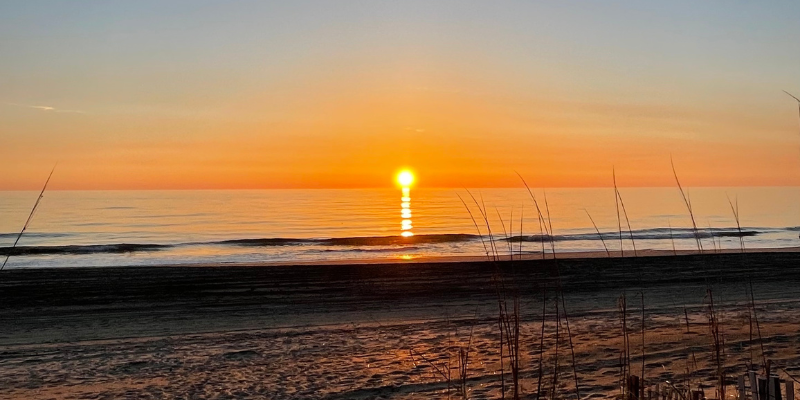 Image of sunset on the sound at Jockey's Ridge State Park.