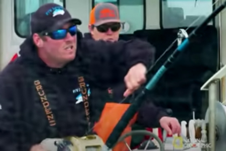 Wicked Tuna OBX - Man fishing in rough water.